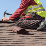 Roofing contractor at work